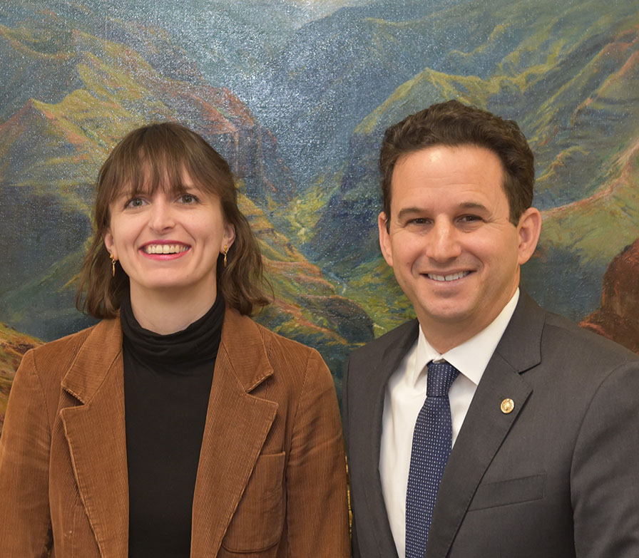 Ashley Booth posing with U.S. Sen. Brian Schatz.