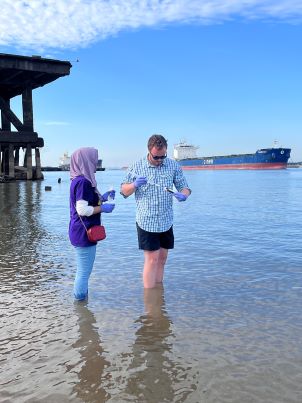 Researchers collect water sample from Mississippi River