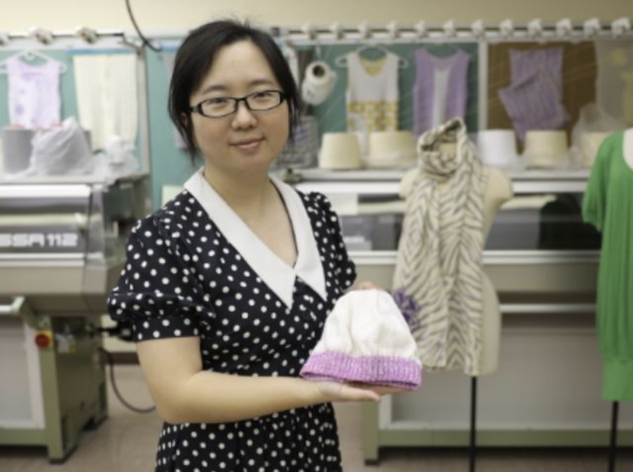 Sibei Xia with a temperature sensitive baby hat