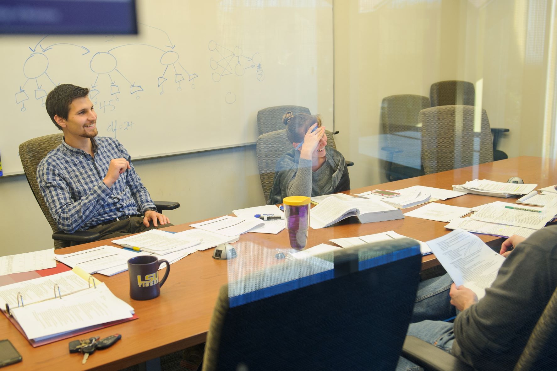 Students work as team in conference room