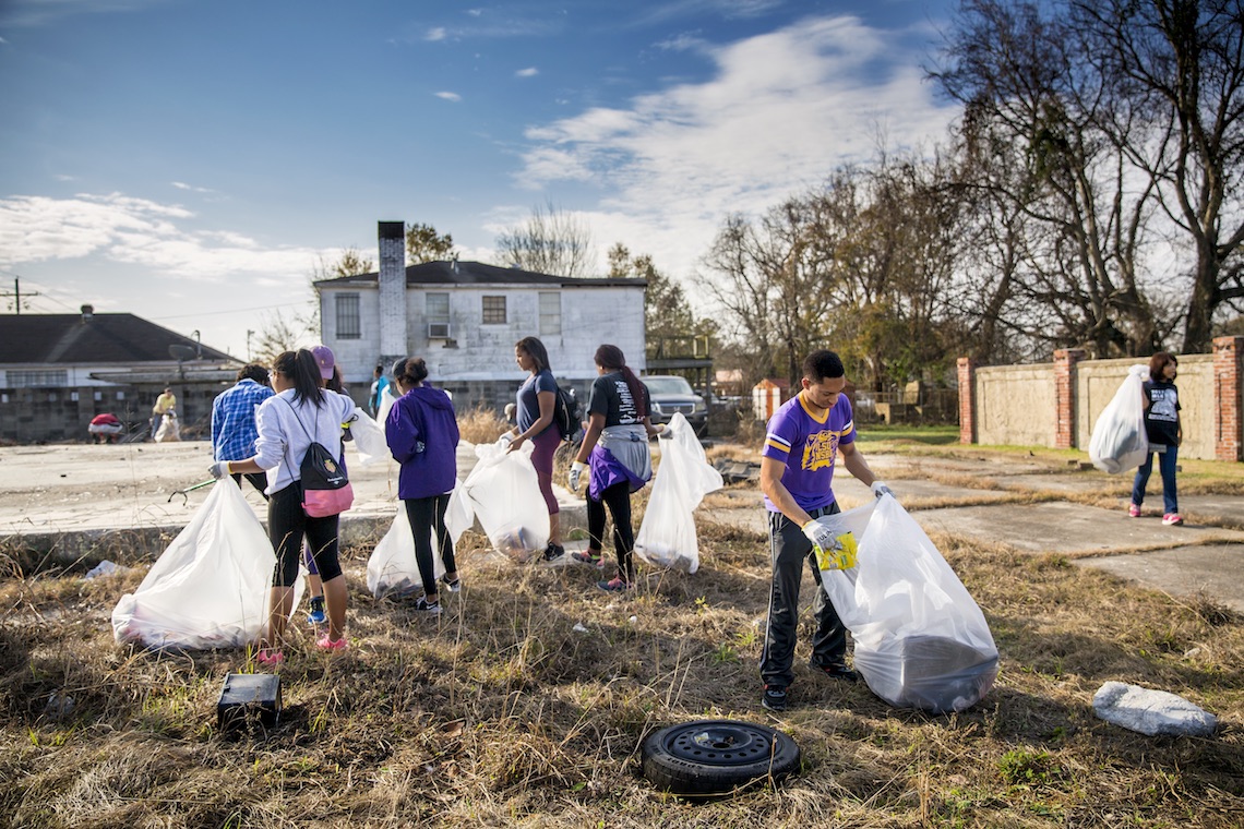 Students collecting trash.