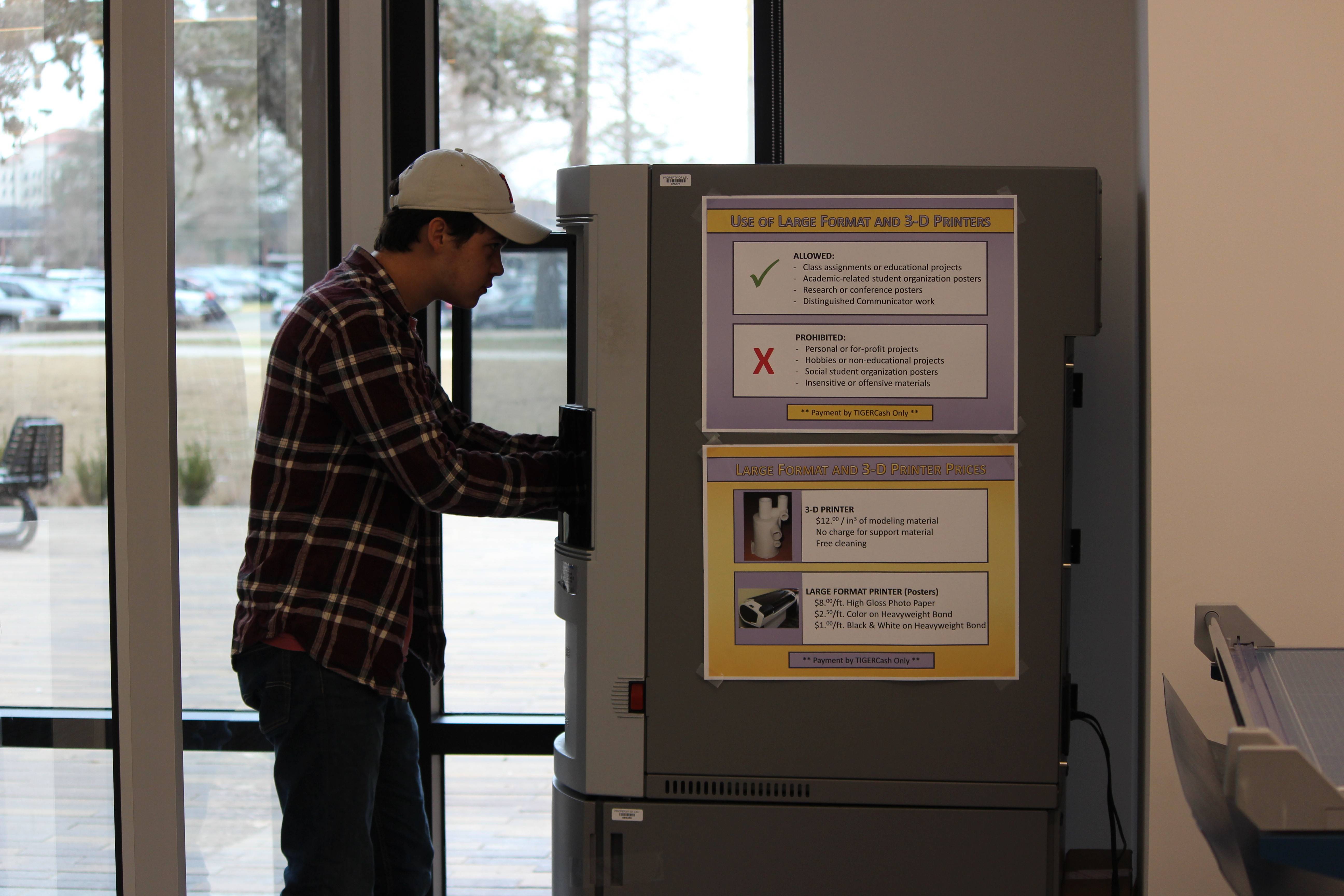 A student uses a 3D printer